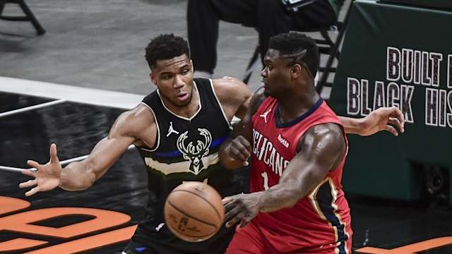 Milwaukee Bucks forward Giannis Antetokounmpo (34) pressures New Orleans Pelicans forward Zion Williamson (1)