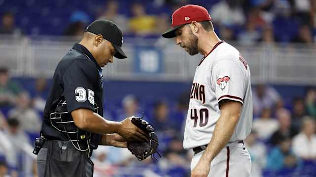 Madison Bumgarner has his glove inspected in Miami