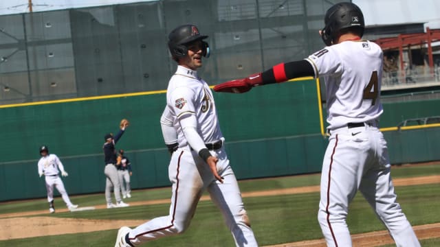 Diamondbacks infielder prospect Blaze Alexander celebrates after scoring a run for the Reno Aces at Greater Nevada Field.
