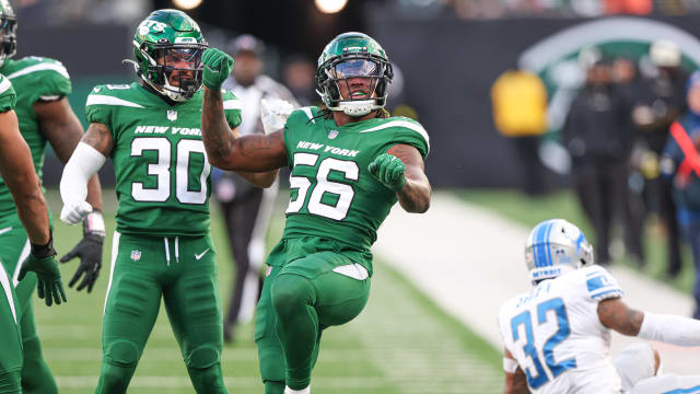Linebacker Quincy Williams celebrates a tackle in a 2022 game vs. Detroit