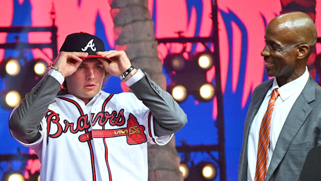 Jul 17, 2022; Los Angeles, CA, USA; Former Atlanta Braves player Fred McGriff presents JR Ritchie right with his jersey after he was selected by the Atlanta Braves as the 35th pick of the MLB draft at Xbox Plaza at LA Live.