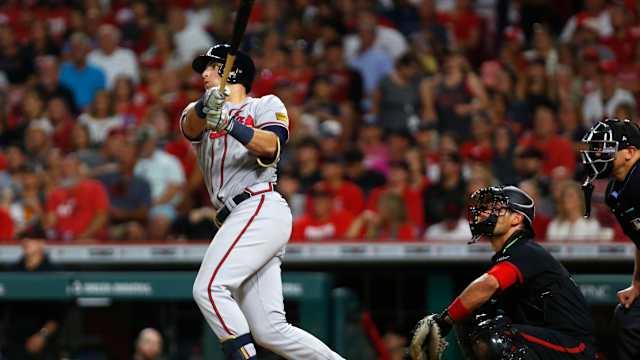 Jun 23, 2023; Cincinnati, Ohio, USA; Atlanta Braves third baseman Austin Riley (27) hits a solo home run against the Cincinnati Reds during the eight inning at Great American Ball Park. Mandatory Credit: David Kohl-USA TODAY Sports
