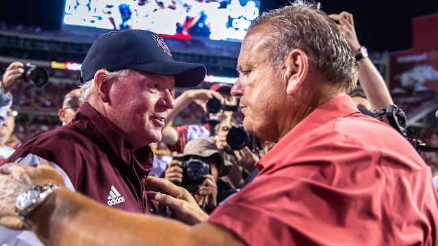 Razorbacks coach Bobby Petrino with Sam Pittman after game last September