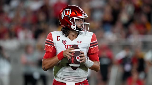 Utah Utes quarterback Cameron Rising (7) drops back to pass against the Arizona State Sun Devils during the first half at Sun Devil Stadium.