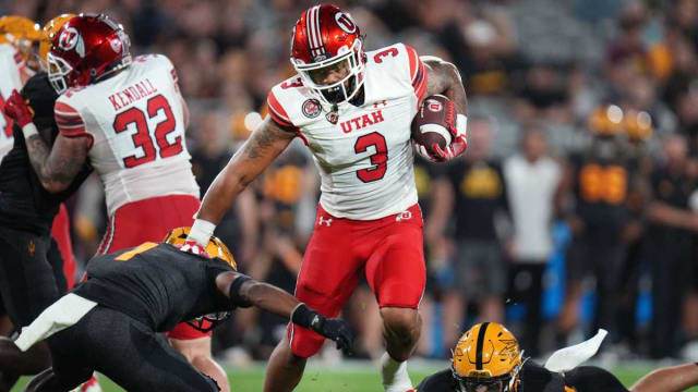 Utah's Ja'Quinden Jackson (3) runs the ball as ASU defenders Jordan Clark (1) and Kyle Soelle (34) dive for the tackle at Sun Devil Stadium on Saturday, Sept. 24, 2022.