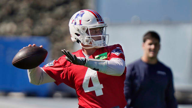 New England Patriots quarterback Bailey Zappe winds up to pass during an NFL football practice, Thursday, Oct. 6, 2022, in Foxborough, Mass.