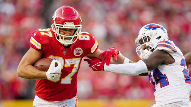 Oct 16, 2022; Kansas City, Missouri, USA; Kansas City Chiefs tight end Travis Kelce (87) stiff arms Buffalo Bills cornerback Kaiir Elam (24) during the second half at GEHA Field at Arrowhead Stadium. Mandatory Credit: Jay Biggerstaff-USA TODAY Sports