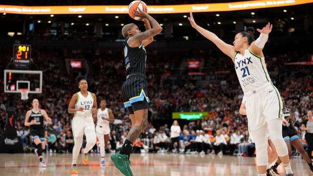 May 13, 2023; Toronto, Ontario, Canada; Minnesota Lynx guard Kayla McBride (21) goes to block a shot by Chicago Sky guard Courtney Williams (10) during the first half at Scotiabank Arena.