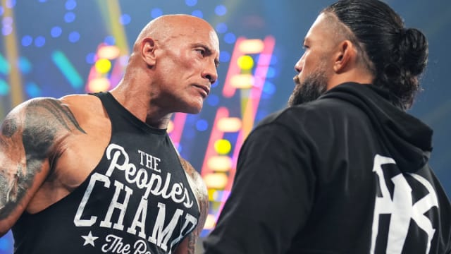 The Rock and Undisputed WWE Universal Champion Roman Reigns stare down on the Feb. 2, 2024 episode of SmackDown.
