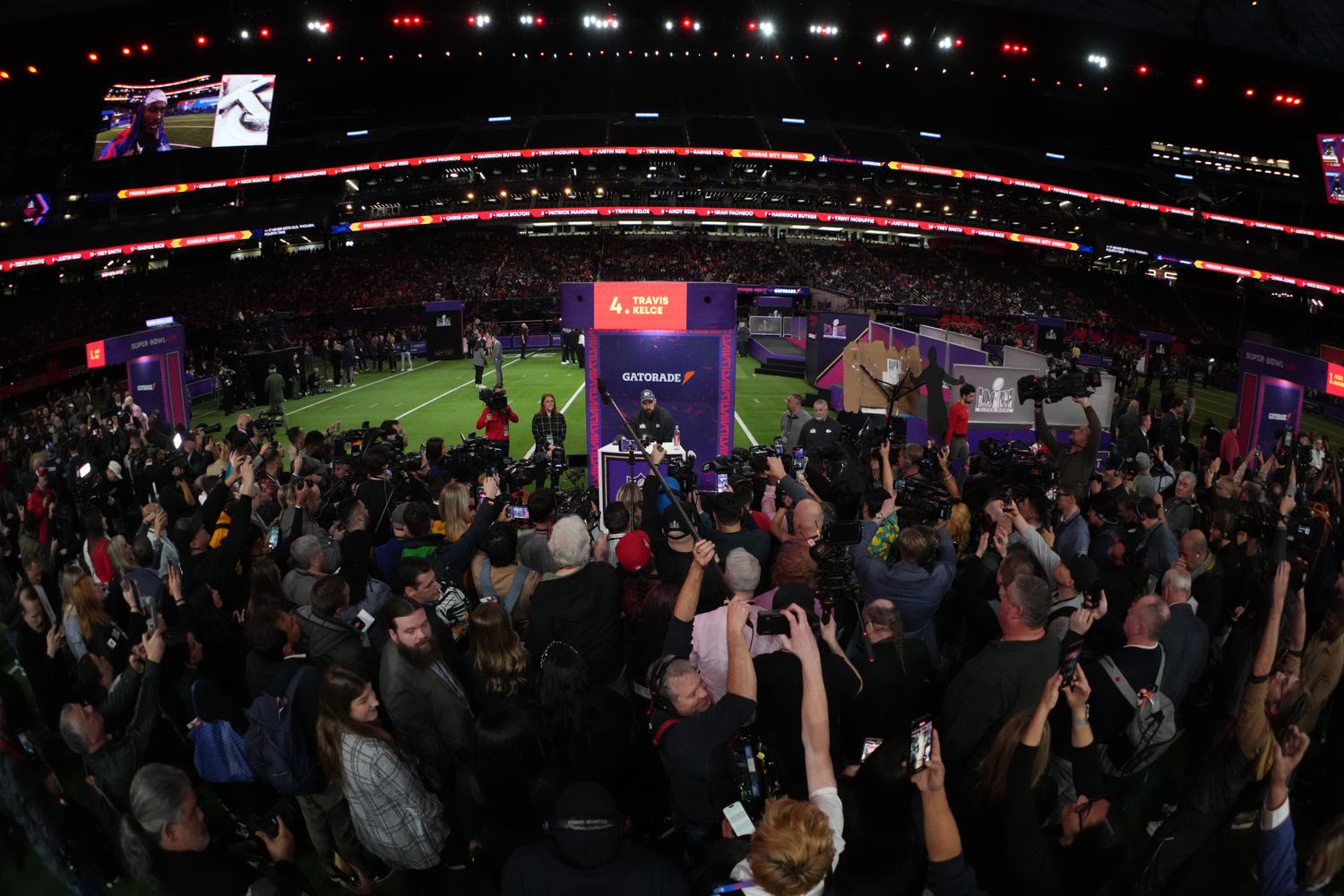 Feb 5, 2024; Las Vegas, NV, USA; A general view as Kansas City Chiefs tight end Travis Kelce (87) is interviewed by media during Super Bowl LVIII Opening Night at Allegiant Stadium. Mandatory Credit: Kirby Lee-USA TODAY Sports  