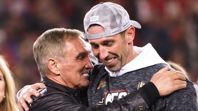 Former Denver Broncos coach Mike Shanahan and son Kyle Shanahan of the San Francisco 49ers.