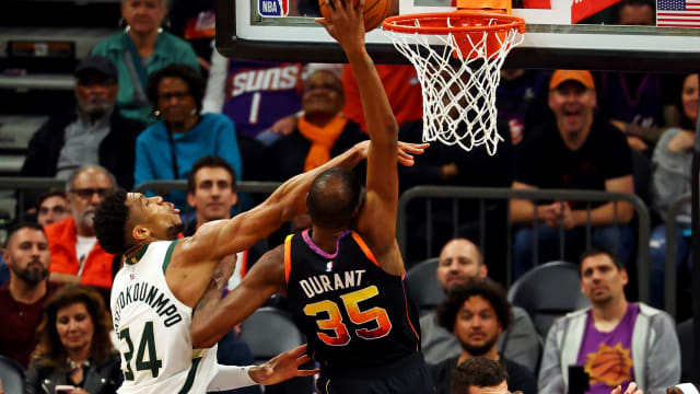 Phoenix Suns forward Kevin Durant (35) shoots the ball against Milwaukee Bucks forward Giannis Antetokounmpo (34)