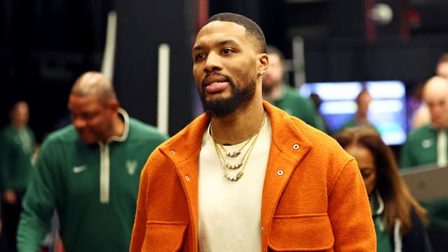 Milwaukee Bucks guard Damian Lillard (0) walks to the locker room at halftime of the game against the Phoenix Suns 