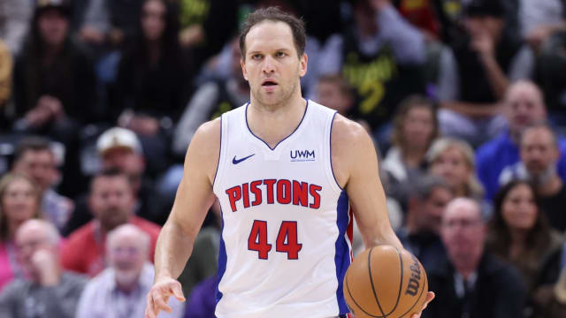 Pistons veteran Bojan Bogdanović dribbles the ball up the court in a game.