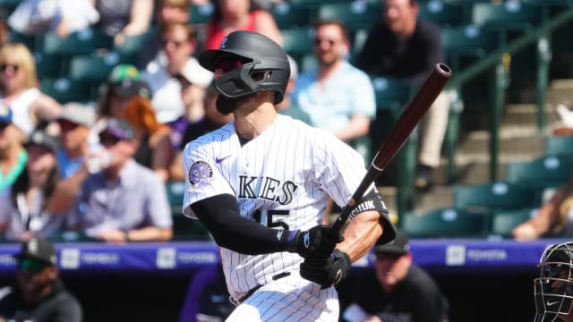 Colorado Rockies outfielder Randal Grichuk (15) bats against the Arizona Diamondbacks at Coors Field on April 30, 2023.