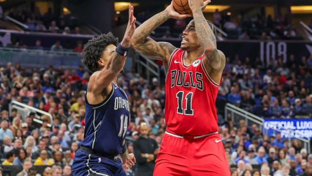 Chicago Bulls forward DeMar DeRozan (11) shoots the ball against Orlando Magic guard Gary Harris (14) during the second half at KIA Center.