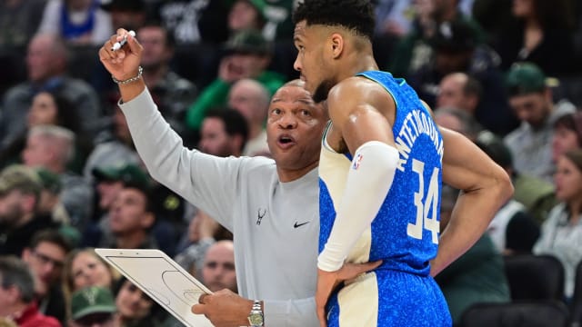 Milwaukee Bucks head coach Doc Rivers draws up a play with forward Giannis Antetokounmpo (34) 