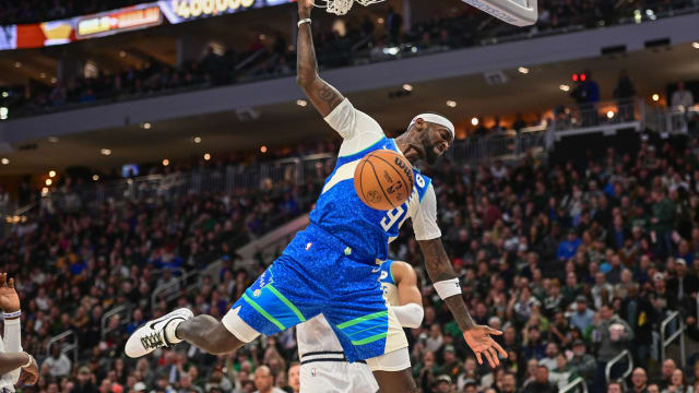 Milwaukee Bucks forward Bobby Portis (9) dunks the ball i