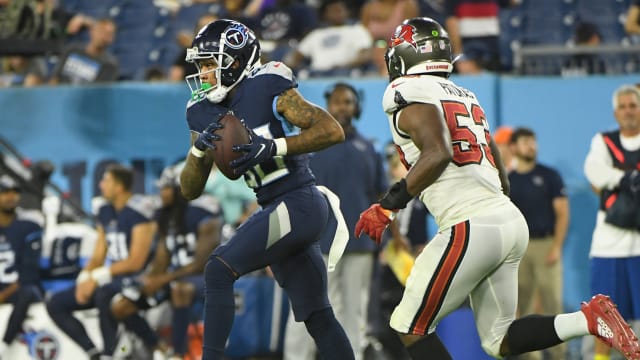 Aug 20, 2022; Nashville, Tennessee, USA; Tennessee Titans wide receiver Terry Godwin (80) makes a catch as Tampa Bay Buccaneers linebacker Olakunle Fatukasi (53) chases during the second half during the second half at Nissan Stadium. Mandatory Credit: Steve Roberts-USA TODAY Sports  