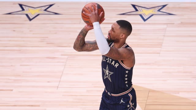 Eastern Conference guard Damian Lillard (0) of the Milwaukee Bucks attempts a three point basket against the Western Conference All-Stars during the third quarter in the 73rd NBA All Star game at Gainbridge Fieldhouse. 