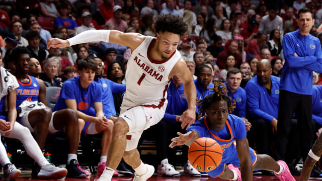 Feb 21, 2024; Tuscaloosa, Alabama, USA; Florida Gators guard Denzel Aberdeen (11) and Alabama Crimson Tide guard Mark Sears (1) reach for a loose ball during the first half at Coleman Coliseum. Mandatory Credit: Butch Dill-USA TODAY Sports