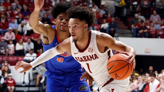Feb 21, 2024; Tuscaloosa, Alabama, USA; Alabama Crimson Tide guard Mark Sears (1) drives the baseline around Florida Gators guard Zyon Pullin (0) during the first half at Coleman Coliseum. Mandatory Credit: Butch Dill-USA TODAY Sports  