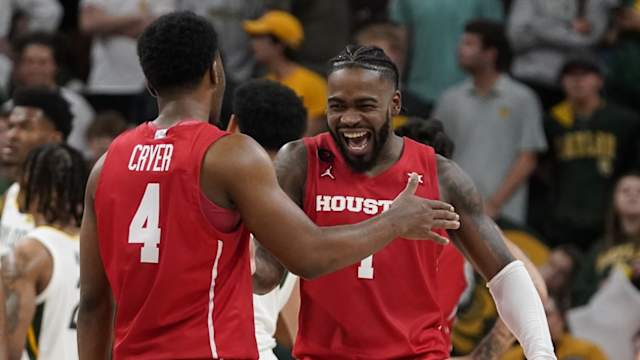 Houston Cougars guard L.J. Cryer (4) and guard Jamal Shead (1) react in the closing moments of overtime against the Baylor Bears at Paul and Alejandra Foster Pavilion.