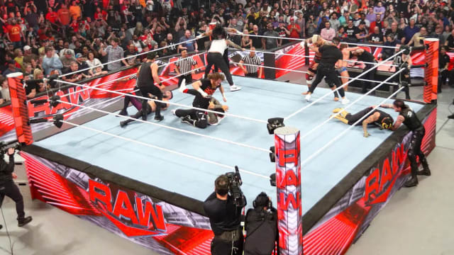 WWE superstars brawl inside the Monday Night Raw ring.