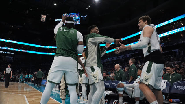 Milwaukee Bucks guard Malik Beasley (5) and center Brook Lopez (11) celebrate the win over the Charlotte Hornets