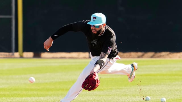 Arizona Diamondbacks' Emmanuel Rivera fields a ground ball during spring training workouts at Salt River Fields at Talking Stick in Scottsdale on Feb. 22, 2024. Mandatory Credit © Rob Schumacher-Arizona Republic / USA TODAY NETWORK