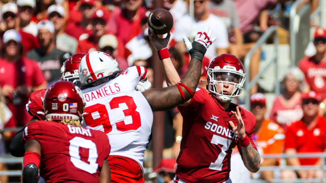 Sep 18, 2021; Norman, Oklahoma, USA; Oklahoma Sooners quarterback Spencer Rattler (7) throws pass Nebraska Cornhuskers defensive lineman Damion Daniels (93) during the second quarter at Gaylord Family-Oklahoma Memorial Stadium. Mandatory Credit: Kevin Jairaj-USA TODAY Sports  