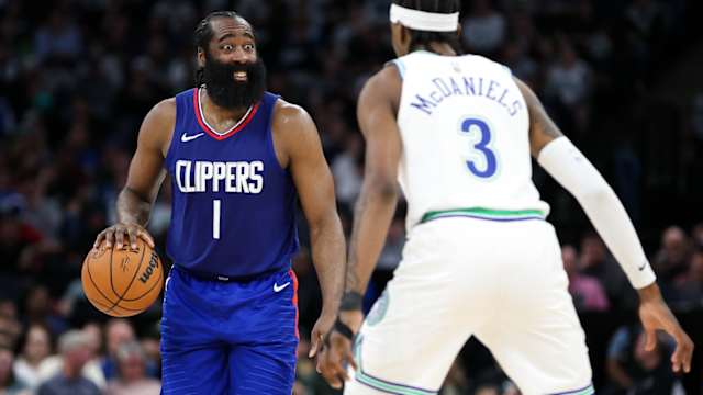 Mar 3, 2024; Minneapolis, Minnesota, USA; LA Clippers guard James Harden (1) dribbles as Minnesota Timberwolves forward Jaden McDaniels (3) defends during the second half at Target Center.