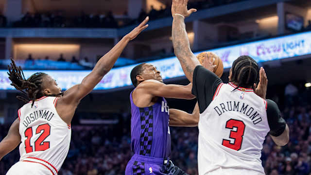 Sacramento Kings guard De'Aaron Fox (5) puts up a shot over Chicago Bulls center Andre Drummond (3) during the second quarter at Golden 1 Center. 