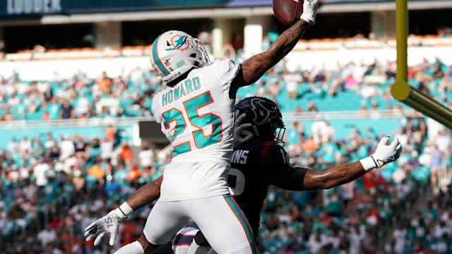 Nov 27, 2022; Miami Gardens, Florida, USA; Miami Dolphins cornerback Xavien Howard (25) breaks up a pass for Houston Texans wide receiver Nico Collins (12) during the second half at Hard Rock Stadium.