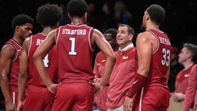 Temple Owls head coach Adam Fisher talks to the team during a timeout in the second half against the Albany Great Danes at Barclays Center in Brooklyn, New York, on Dec. 10, 2023.