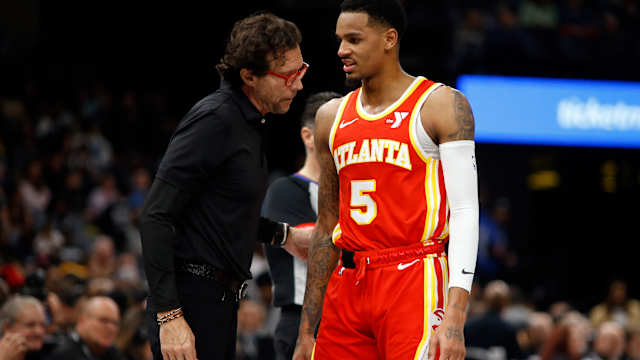 Mar 8, 2024; Memphis, Tennessee, USA; Atlanta Hawks head coach Quin Snyder (left) talks with Atlanta Hawks guard Dejounte Murray (5) during the first half against the Memphis Grizzlies at FedExForum. Mandatory Credit: Petre Thomas-USA TODAY Sports