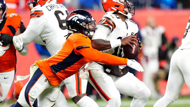 Nov 26, 2023; Denver, Colorado, USA; Denver Broncos safety P.J. Locke (6) sacks Cleveland Browns quarterback PJ Walker (10) in the fourth quarter at Empower Field at Mile High. Mandatory Credit: Ron Chenoy-USA TODAY Sports