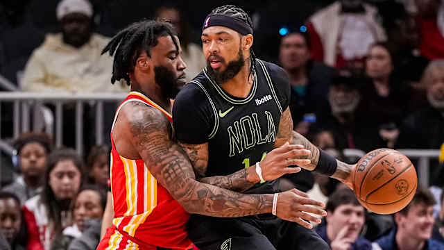 Mar 10, 2024; Atlanta, Georgia, USA; New Orleans Pelicans forward Brandon Ingram (14) dribbles guarded by Atlanta Hawks forward Saddiq Bey (41) during the first half at State Farm Arena. Mandatory Credit: Dale Zanine-USA TODAY Sports