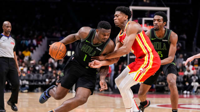 Mar 10, 2024; Atlanta, Georgia, USA; New Orleans Pelicans forward Zion Williamson (1) dribbles against Atlanta Hawks forward De'Andre Hunter (12) during the second half at State Farm Arena. Mandatory Credit: Dale Zanine-USA TODAY Sports