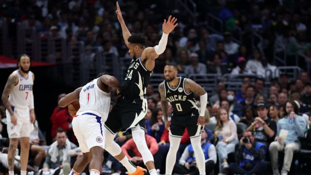 Milwaukee Bucks forward Giannis Antetokounmpo (34) defends Los Angeles Clippers guard James Harden (1)