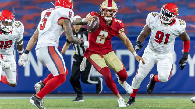 Apr 15, 2023; Birmingham, AL, USA; Birmingham Stallions quarterback Alex McGough (2) runs the ball between New Jersey Generals defensive back Shalom Luani (5) and defensive lineman Kevin Thurmon Jr. (91) during the second half of a USFL football game at Protective Stadium. Mandatory Credit: Vasha Hunt-USA TODAY Sports  