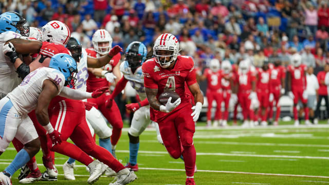 May 13, 2023; San Antonio, TX, USA; DC Defenders running back Abram Smith (4) runs in for a touchdown in the first half against the Arlington Renegades at the Alamodome. Mandatory Credit: Daniel Dunn-USA TODAY Sports  