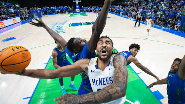 McNeese's Christian Shumate is blocked by TAMUCC's Stephen Giwa during the game at the American Bank Center on Monday, Jan. 22, 2024, in Corpus Christi, Texas.  