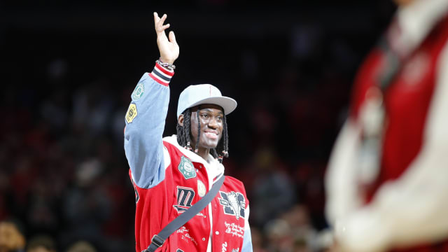 Jan 20, 2024; Columbus, Ohio, USA; Ohio State Buckeyes wide receiver Marvin Harrison Jr. is honored at center court during the first half of the game between the Ohio State Buckeyes and the Penn State Nittany Lions at Value City Arena.