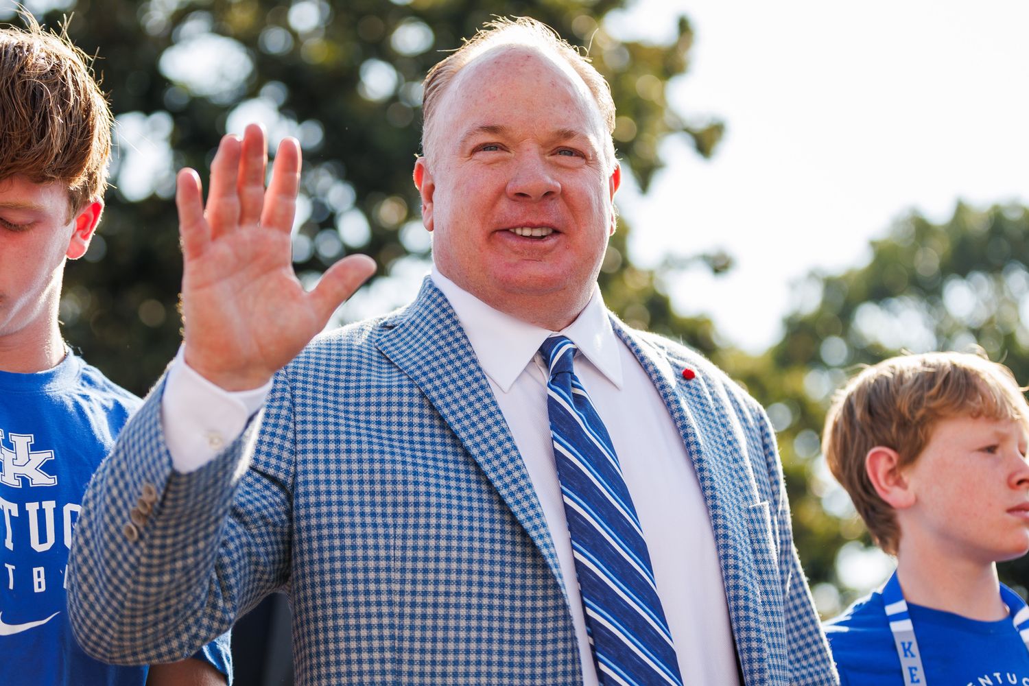 Sep 2, 2023; Lexington, Kentucky, USA; Kentucky Wildcats head coach Mark Stoops waves to fans at cat walk before the game against the Ball State Cardinals at Kroger Field. Mandatory Credit: Jordan Prather-USA TODAY Sports  
