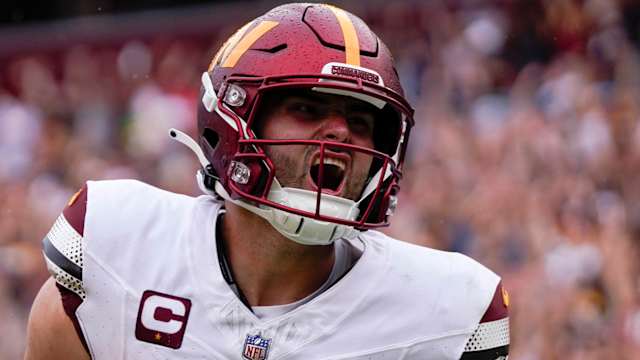 Sep 10, 2023; Landover, Maryland, USA; Washington Commanders quarterback Sam Howell (14) reacts after rushing for a touchdown against the Arizona Cardinals at FedExField. Mandatory Credit: Brent Skeen-USA TODAY Sports