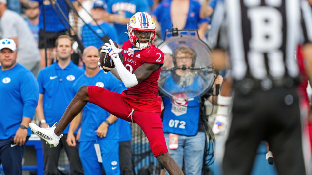 Sep 23, 2023; Lawrence, Kansas, USA; Kansas Jayhawks cornerback Cobee Bryant (2) intercepts a pass during the second half against the Brigham Young Cougars at David Booth Kansas Memorial Stadium. Mandatory Credit: Jay Biggerstaff-USA TODAY Sports  