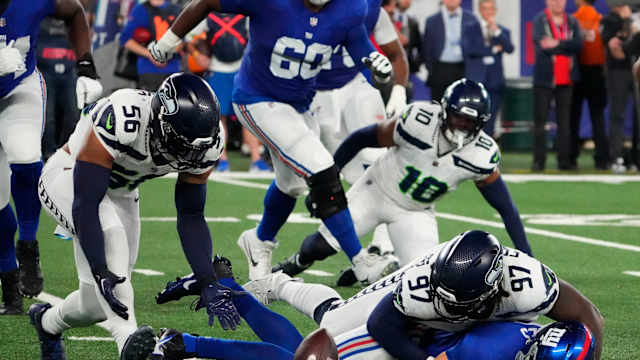 Oct 2, 2023; East Rutherford, New Jersey, USA; Seattle Seahawks linebacker Jordyn Brooks (56) picks up the loose ball after defensive end Mario Edwards Jr. (97) stripped the ball from New York Giants quarterback Daniel Jones (8) at MetLife Stadium.