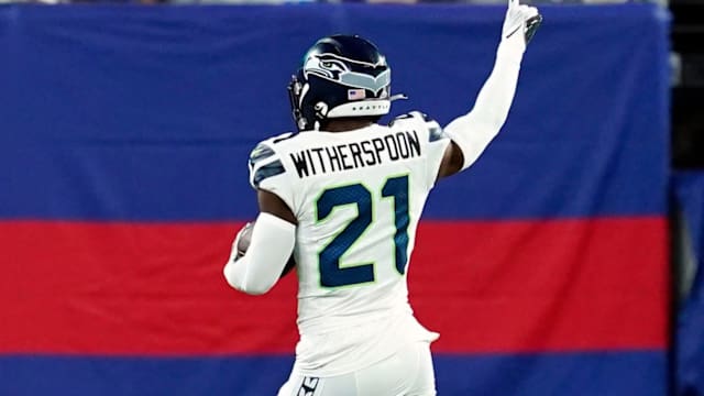Seattle Seahawks cornerback Devon Witherspoon (21) scores a touchdown after intercepting a pass thrown by New York Giants quarterback Daniel Jones (not pictured) in the second half.