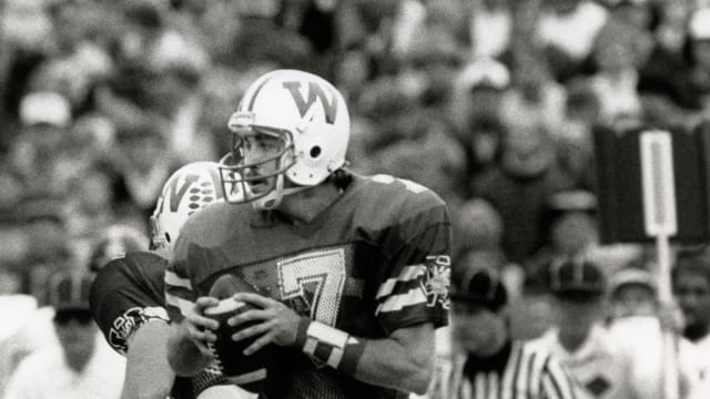 Oct 12, 1985; Madison, WI, USA; FILE PHOTO; Wisconsin Badgers quarterback Mike Howard (7) in action against the Iowa Hawkeyes. Mandatory Credit: Malcolm Emmons-USA TODAY Sports